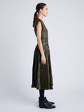 Proenza Schouler Side full length image of model wearing Lyra Pleated Top in Lightweight Faux Leather in DARK FERN