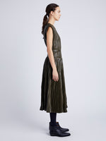 Proenza Schouler Side full length image of model wearing Lyra Pleated Top in Lightweight Faux Leather in DARK FERN