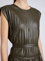 Proenza Schouler Detail image of model wearing Lyra Pleated Top in Lightweight Faux Leather in DARK FERN