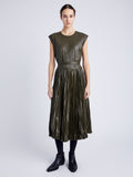 Proenza Schouler Front full length image of model wearing Lyra Pleated Top in Lightweight Faux Leather in DARK FERN tucked in