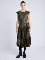 Proenza Schouler Front full length image of model wearing Lyra Pleated Top in Lightweight Faux Leather in DARK FERN tucked in