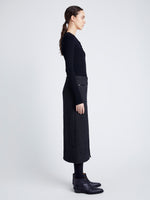 Proenza Schouler Side full length image of model wearing Kingsley Skirt in Soft Twill Coating in BLACK/GREY