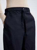 Proenza Schouler Detail image of model wearing Preston Drawstring Pant in Tech Cotton in BLACK