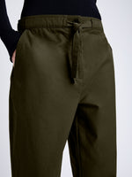 Proenza Schouler Detail image of model wearing Preston Drawstring Pant in Tech Cotton in DARK FERN