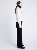 Proenza Schouler Side full length image of model wearing Lou Knit Cardigan in Wool Blend in OFF WHITE