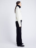 Proenza Schouler Side full length image of model wearing Lou Knit Cardigan in Wool Blend in OFF WHITE