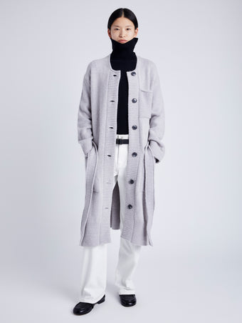 Proenza Schouler Front full length image of model wearing Lenora Knit Cardigan in Wool Blend in LIGHT GREY