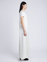 Proenza Schouler Side full length image of model wearing Delphine Dress in Satin in ENOKI