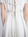 Proenza Schouler Detail image of model wearing Delphine Dress in Satin in ENOKI