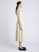 Proenza Schouler Side full length image of model wearing Lyra Top in Faux Leather in ENOKI