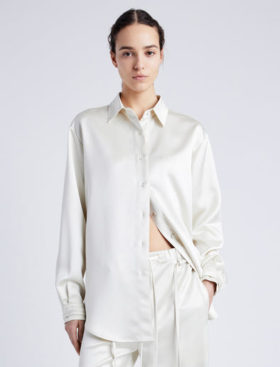 Proenza Schouler Front cropped image of model wearing Raven Shirt in Satin in ENOKI