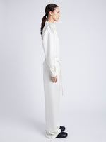 Proenza Schouler Side full length image of model wearing Magnus Pant in Satin in ENOKI