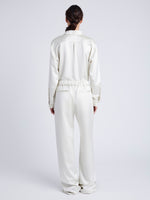 Proenza Schouler Back full length image of model wearing Magnus Pant in Satin in ENOKI