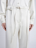 Proenza Schouler Detail image of model wearing Magnus Pant in Satin in ENOKI