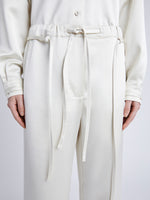 Proenza Schouler Detail image of model wearing Magnus Pant in Satin in ENOKI