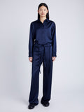 Proenza Schouler Front full length image of model wearing Magnus Pant in Satin in INK