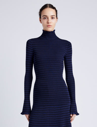 Proenza Schouler Front cropped image of model wearing Phyllis Turtleneck in Geo Knits in NAVY/BLACK