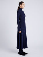 Proenza Schouler Side full length image of model wearing Phyllis Turtleneck in Geo Knits in NAVY/BLACK