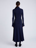 Proenza Schouler Back full length image of model wearing Phyllis Turtleneck in Geo Knits in NAVY/BLACK