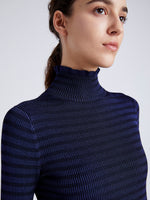 Proenza Schouler Detail image of model wearing Phyllis Turtleneck in Geo Knits in NAVY/BLACK