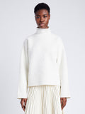 Proenza Schouler cropped front image of model wearing  Asher Sweater in Brushed Knit in EGGSHELL