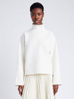 Proenza Schouler cropped front image of model wearing  Asher Sweater in Brushed Knit in EGGSHELL