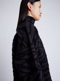 Proenza Schouler detail image of model wearing Asher Sweater in Brushed Knit in HICKORY/BLACK