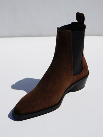 Proenza Schouler 3/4 front editorial image of Bronco Chelsea Boots in DARK BROWN