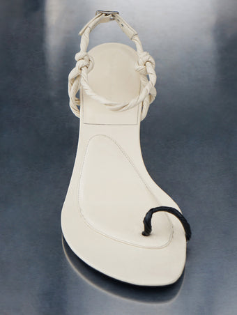 Proenza Schouler front editorial image of the Tee Toe Ring Sandals in CREAM/BLACK