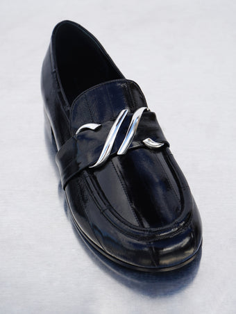 Proenza Schouler 3/4 front editorial image of Monogram Loafers in Eel in BLACK